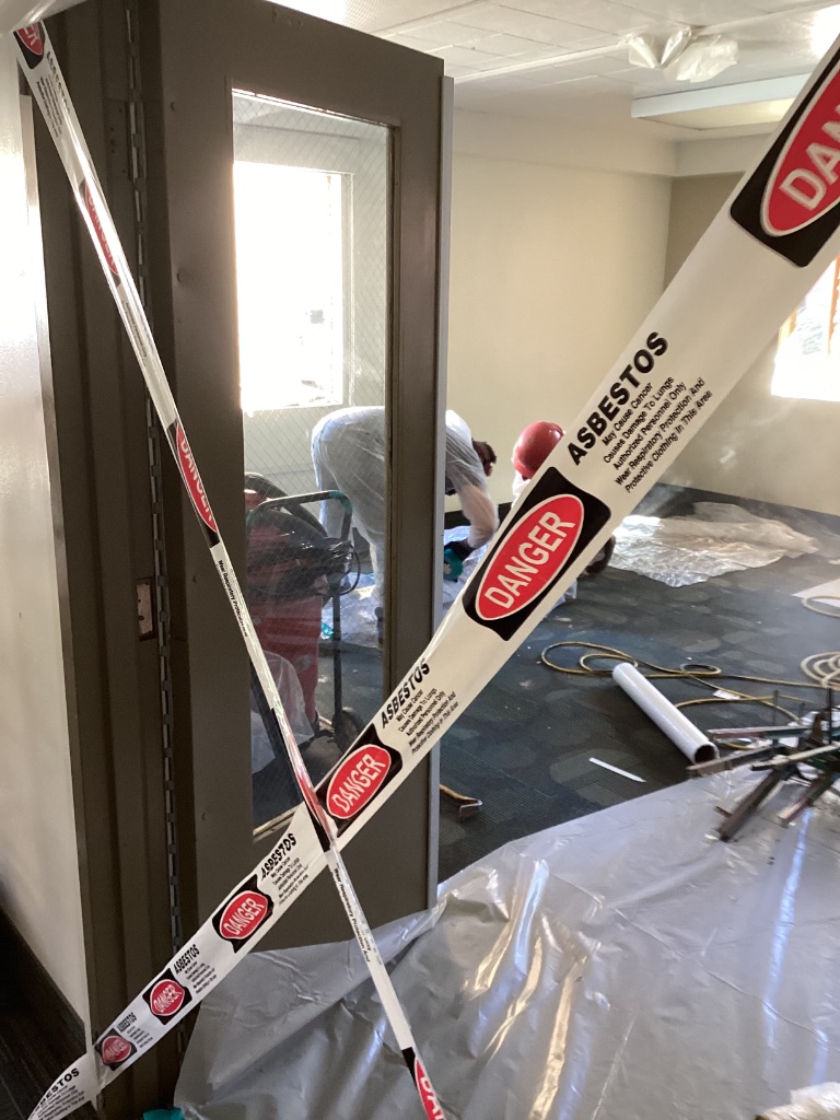 Asbestos warning tape and controlled access at ASU Irish Hall