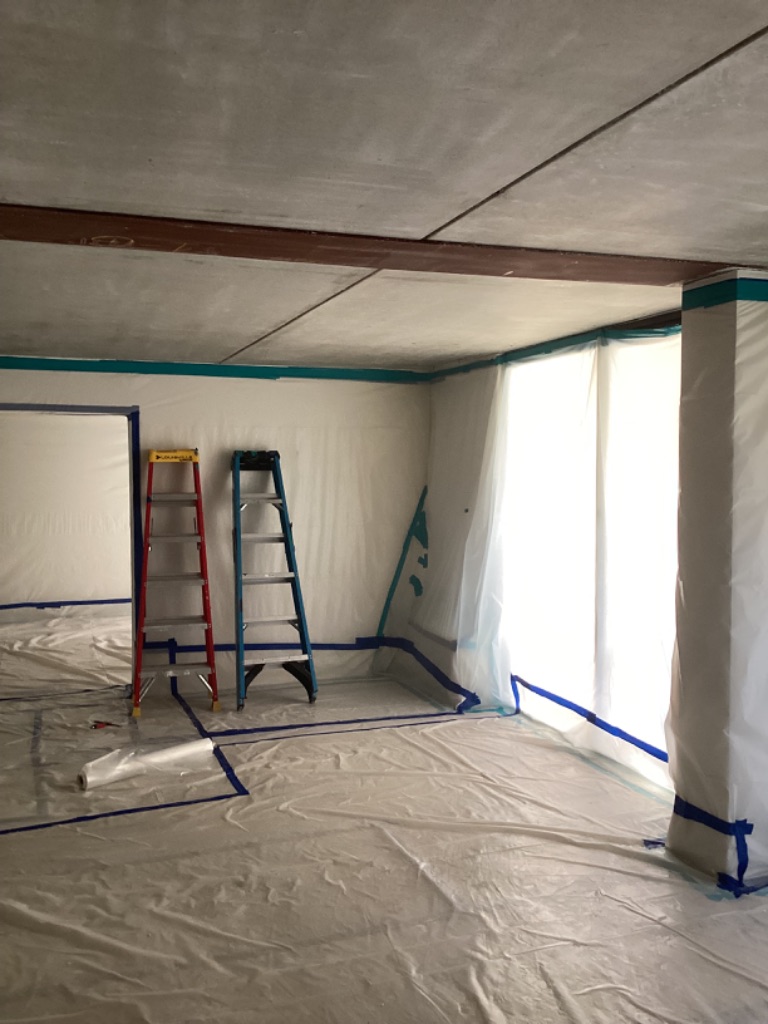 Poly containment and floor protection inside a hotel work area
