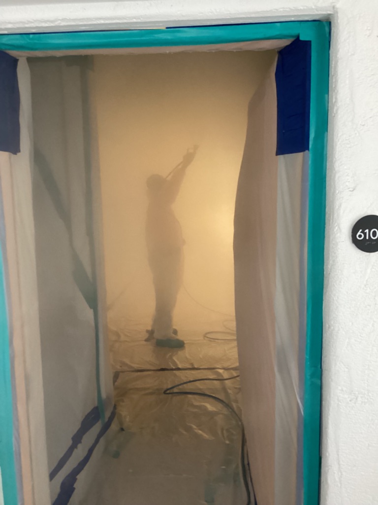 Worker inside a contained hotel work area