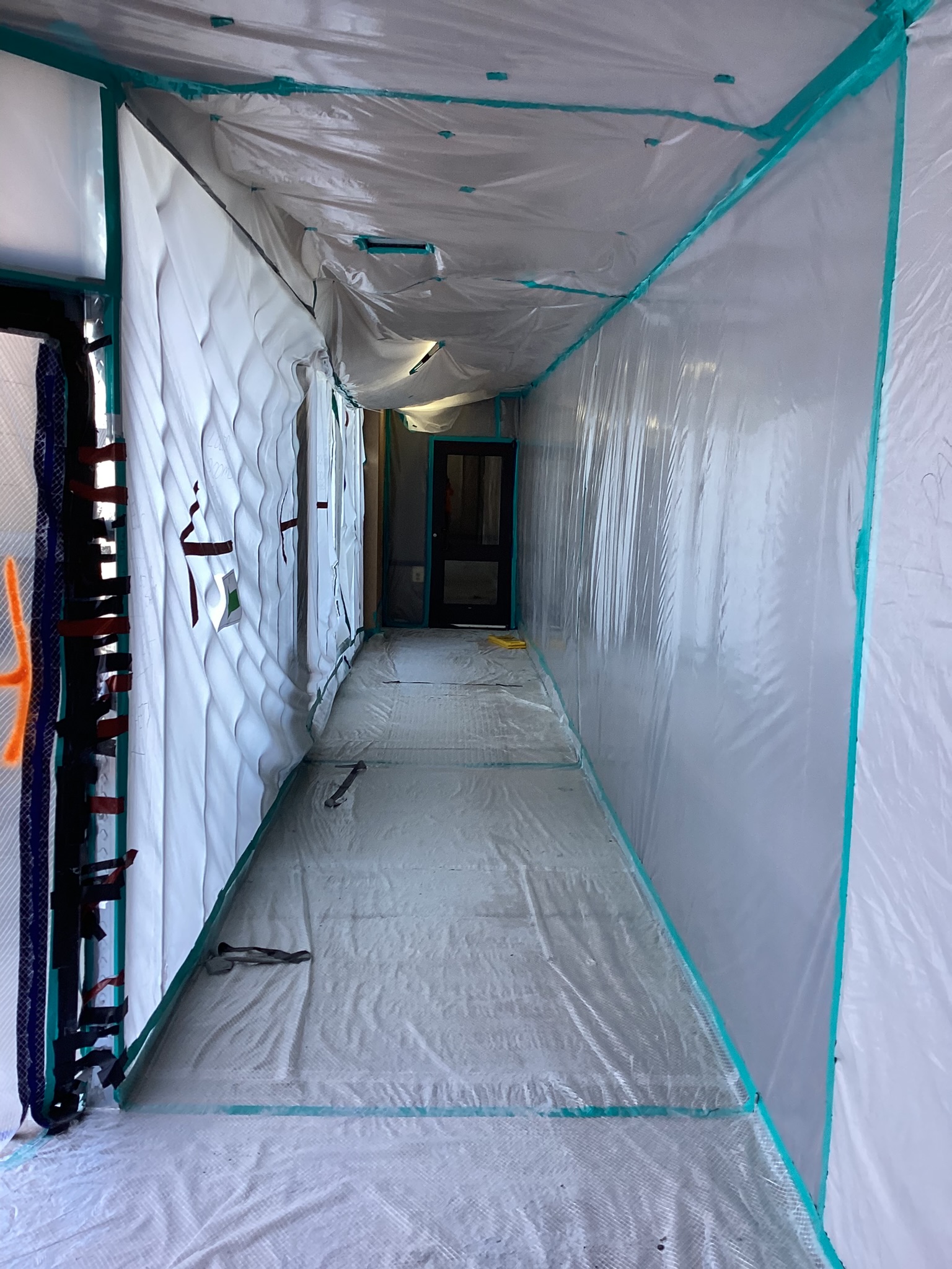 Commercial containment corridor with floor protection