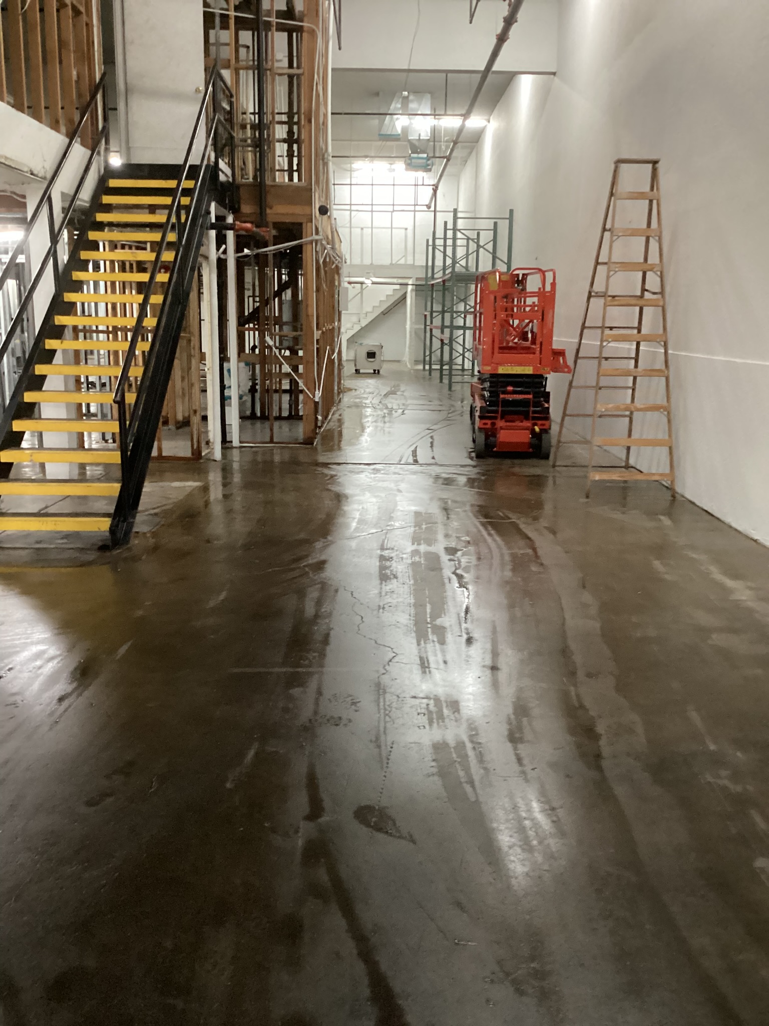 Commercial interior demolition work area with protected surfaces