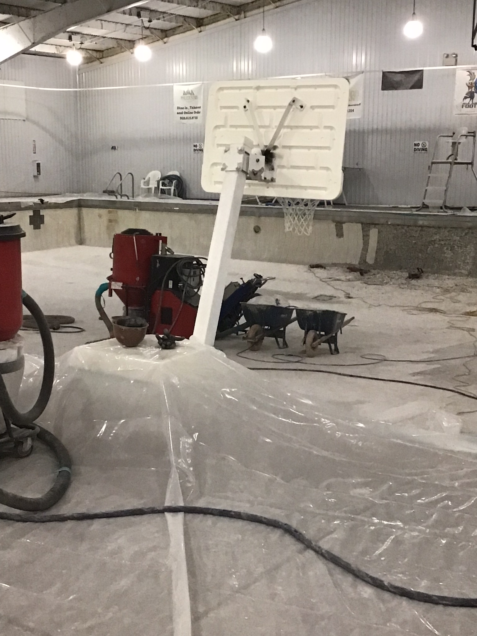 Surface protection and cleaning equipment in a recreational facility work area