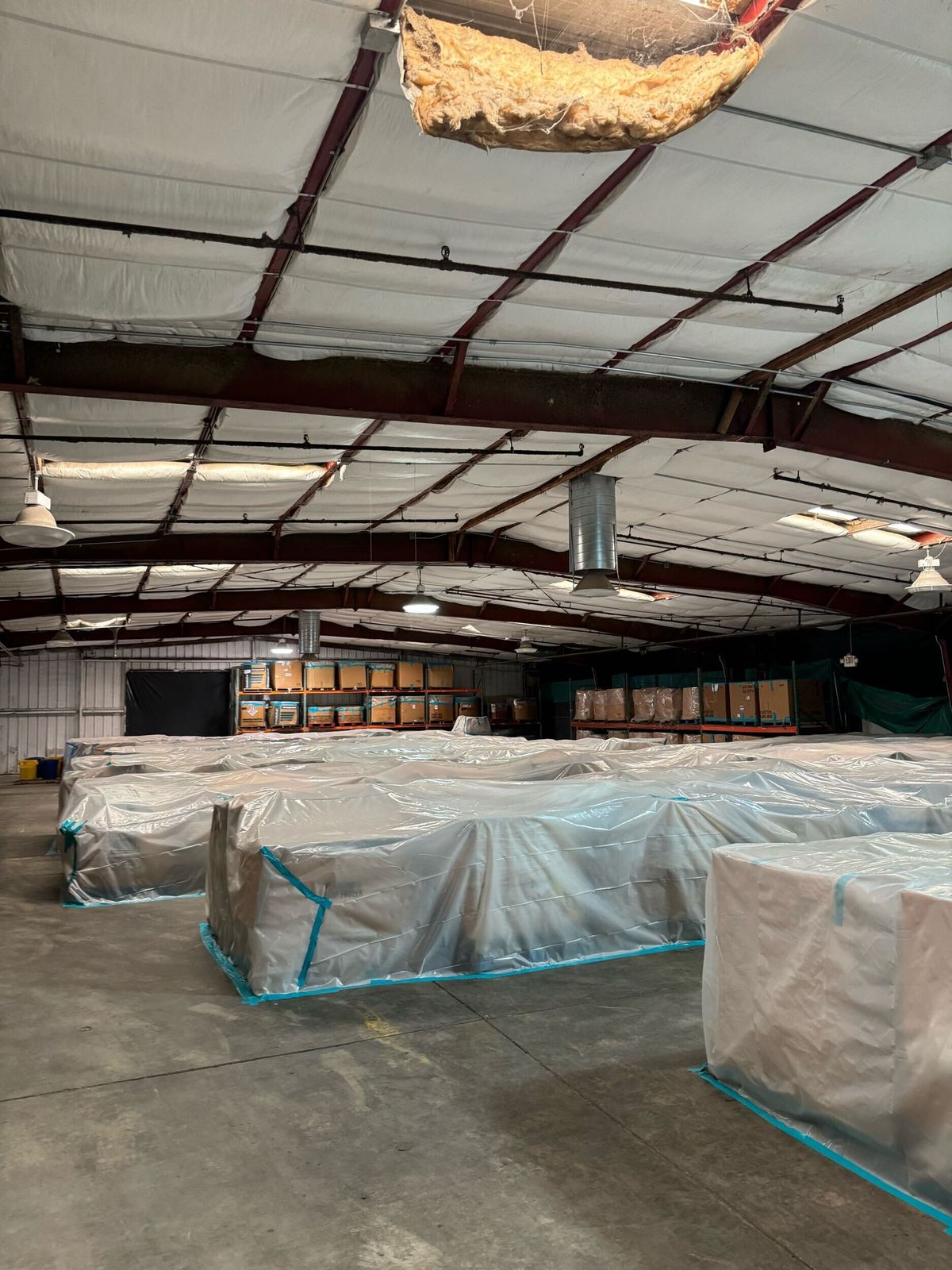 Poly protection and taped controls inside the warehouse.