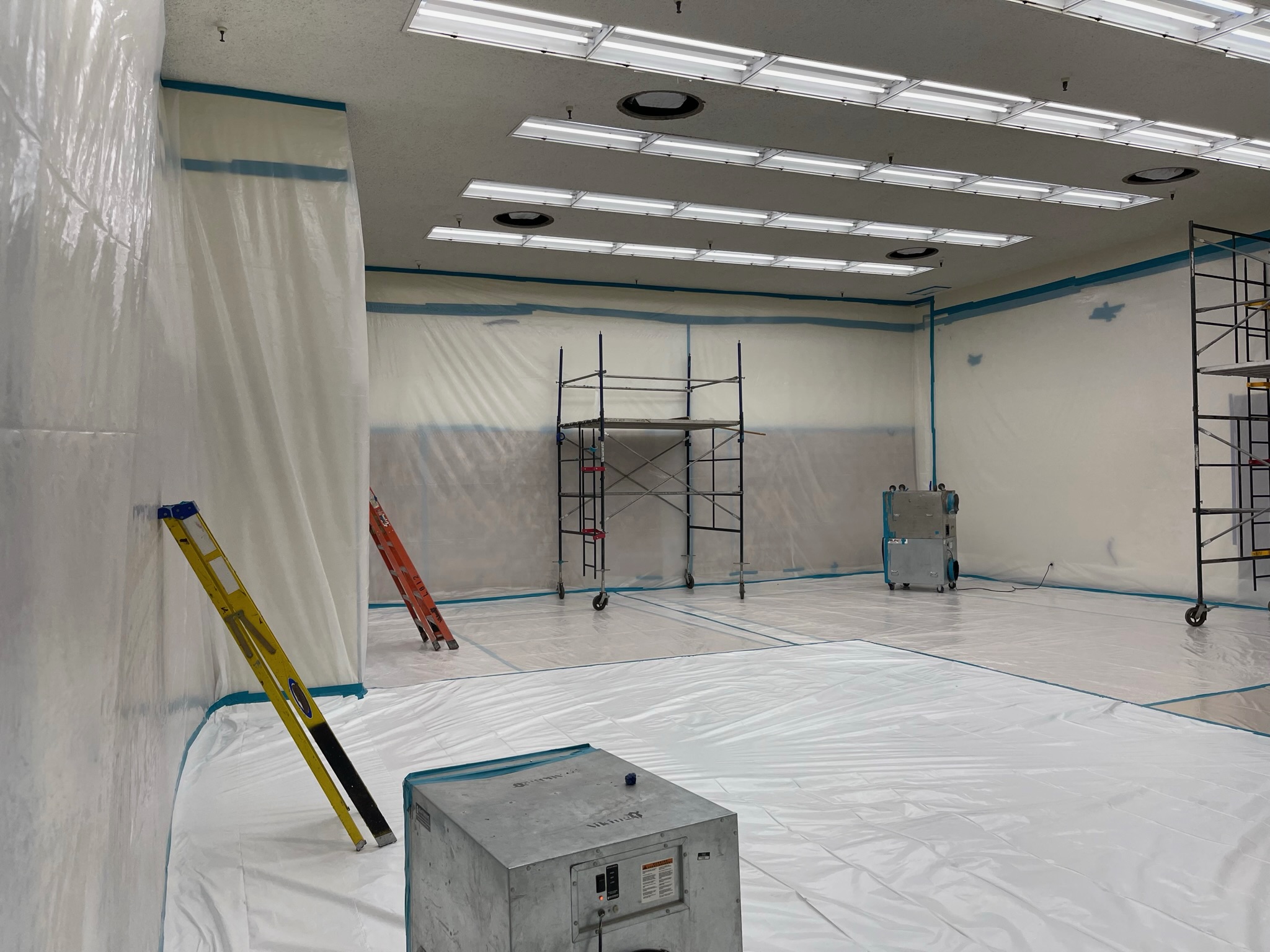Commercial containment room with HEPA filtration and protected surfaces